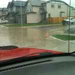 Drainage Issue on Road at 201–299 Sage Valley Dr NW