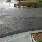 Drainage Issue on Road at 2004 2040 9 Ave SE Calgary, Ab T2 G 0 V5