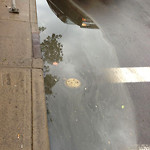 Drainage Issue on Road at 401–599 11 Ave SW