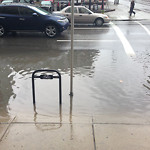 Drainage Issue on Road at 401–599 11 Ave SW