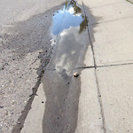 Drainage Issue on Road at 82–110 Harvest Park Rd NE