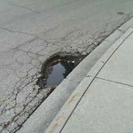 Potholes at 2211 2215 Hope St SW Calgary, Ab T2 S 0 M8