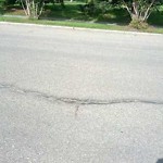 Potholes at 2812 24 St NW Calgary, Ab T2 M 4 J9