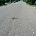 Potholes at 2819 2827 24 St NW Calgary, Ab T2 M 4 J9