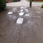 Potholes at 2533–2627 25 Ave SW