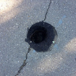 Potholes at 1100–1108 Varsity Estates Rise NW