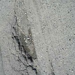 Potholes at 3703 3707 Brantford Dr NW Calgary, Ab T2 L 1 H7