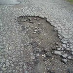 Potholes at 32 St SW Calgary, Ab T3 E 1 E3