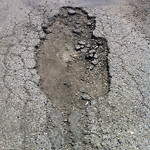 Potholes at 801–899 Mc Neill Rd NE