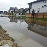 Drainage Issue on Road at Auburn Glen Dr SE Calgary, Ab T3 S