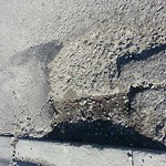 Potholes at 3915 34 St NE Calgary, Ab T1 Y 6 Z8
