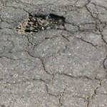 Potholes at 7701–7799 44 St SE