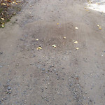 Potholes at 2501–2503 13 Ave NW