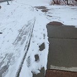 Snow on Pathway or City-maintained Sidewalk at 603 Walden Dr SE