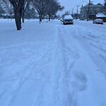 Snow On City-maintained Pathway or Sidewalk at 825 6 St NE