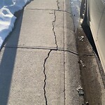 Sidewalk or Curb - Repair at 95 Saddlecrest Wy NE