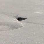 Road Repair at 102 7a St Ne, Calgary, Ab T2 E 9 C3, Canada