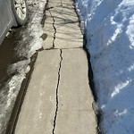 Sidewalk or Curb - Repair at 27 Saddlecrest Wy NE