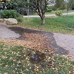 Sprinkler Maintenance in a Park at 425 1 St NE