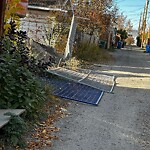 Debris on Backlane at 708 Radford Rd NE