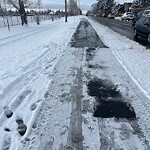 Snow On City - Maintained Sidewalk at 1704 50 Av SW